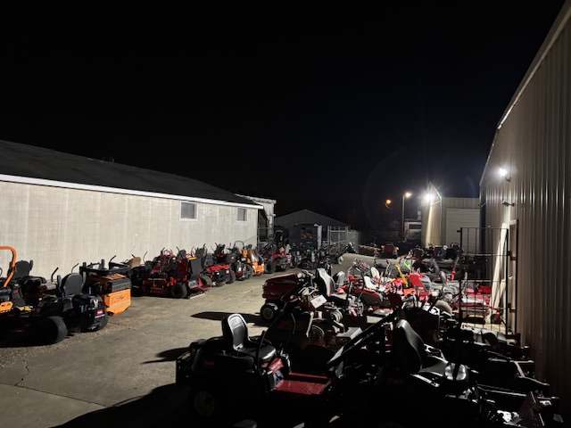 Outdoor commercial equipment yard with new exterior lighting illuminating equipment storage