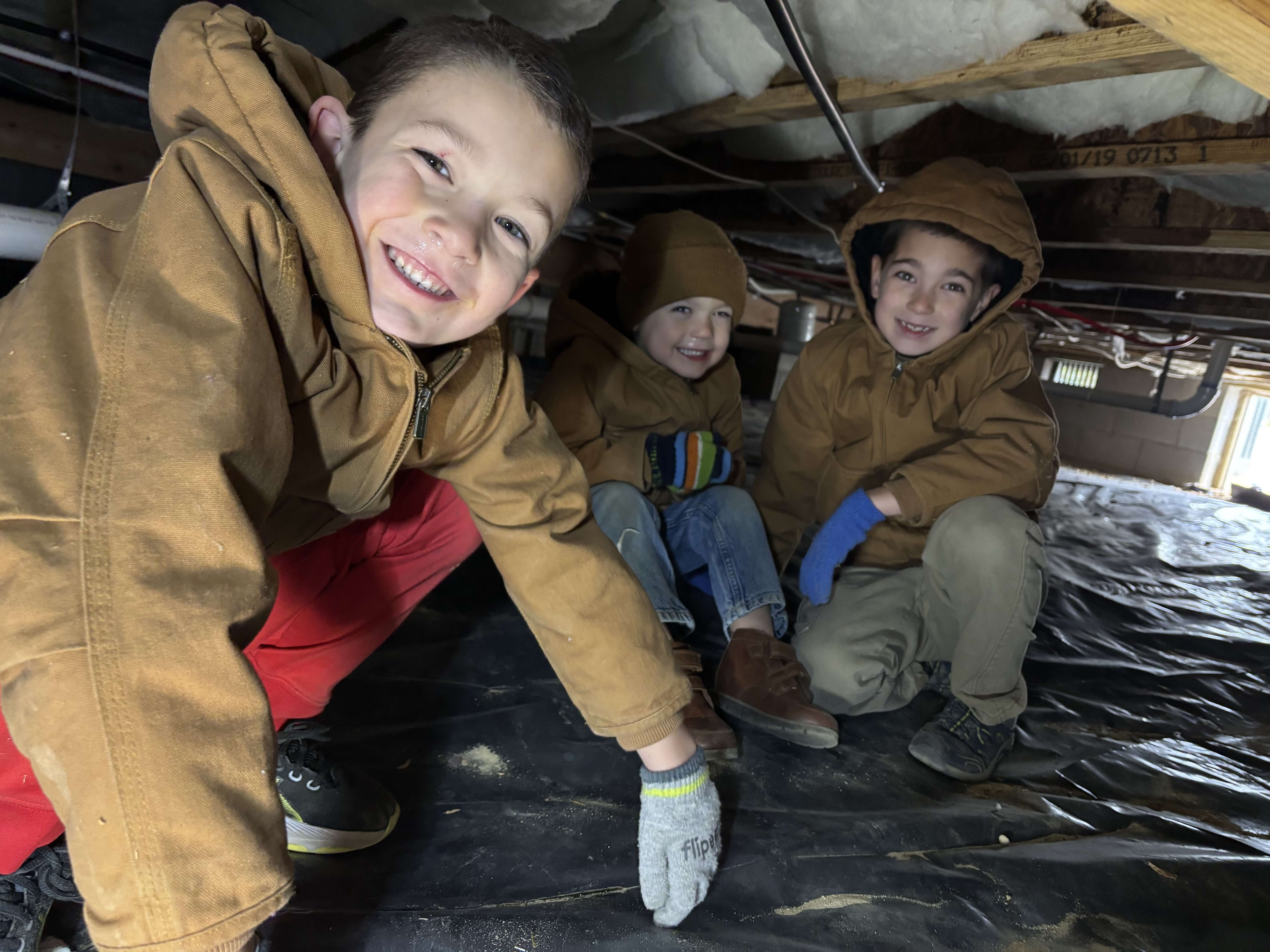 Stephen's sons helping out in a residential crawl space